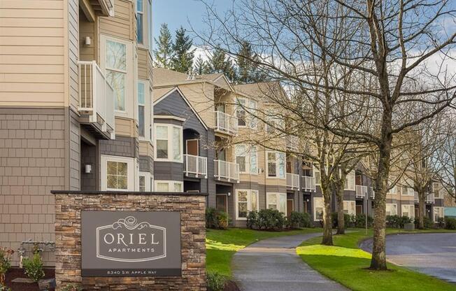 an apartment building with a sign that reads oriel apartments