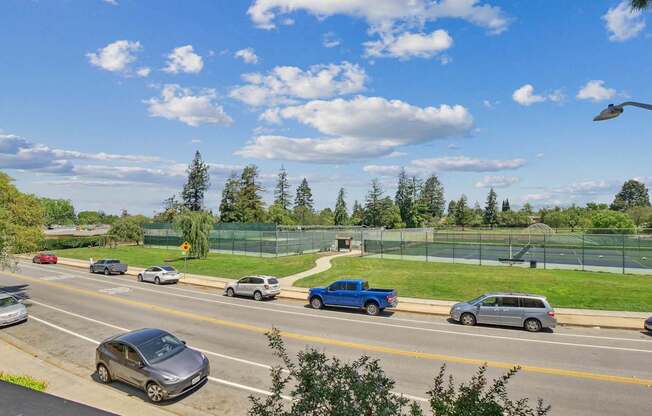 a busy highway with cars driving down it at Summerwood Apartments, Santa Clara, CA