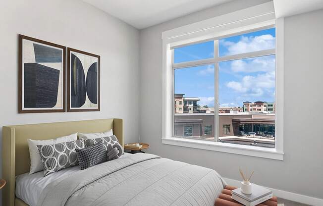 Model Bedroom with Carpet and Window View at Seven Skies Apartments located in Sandy, UT.
