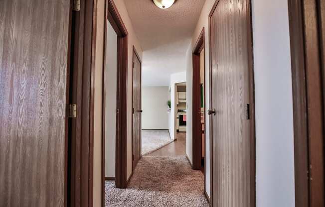 Grand Forks Primrose Apartments. a hallway to bedrooms and a bathroom