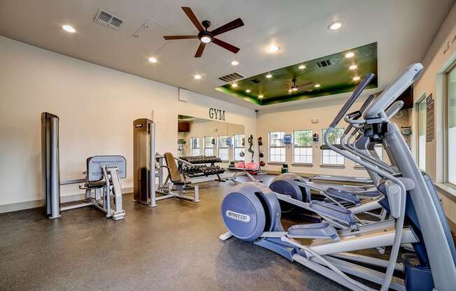 a gym with a variety of exercise equipment