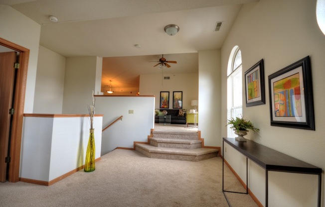 the view of the entryway from the living room into the dining room