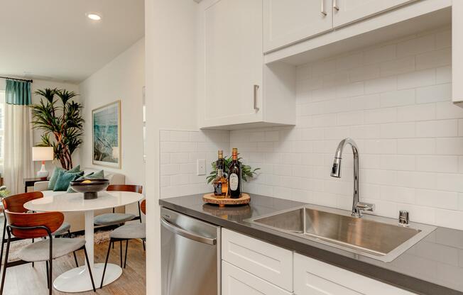 a kitchen with a sink and a mirror