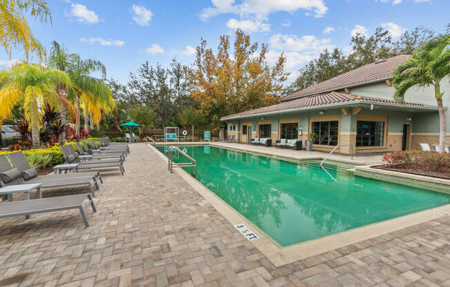 The Preserve at Westchase Apartments pool with lounge seating