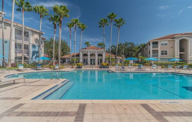 Swimming Pool with Lounge Seating at The Boot Ranch Apartments, Palm Harbor