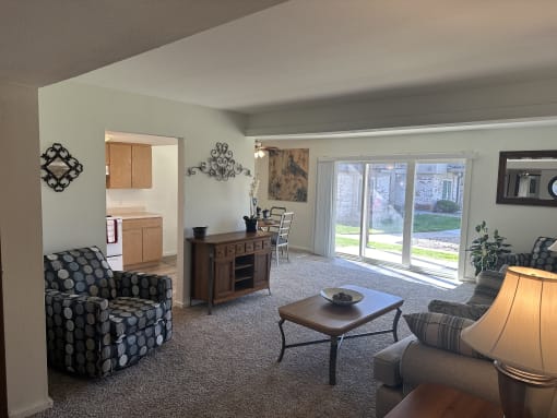 a living room with a couch and a chair and a table