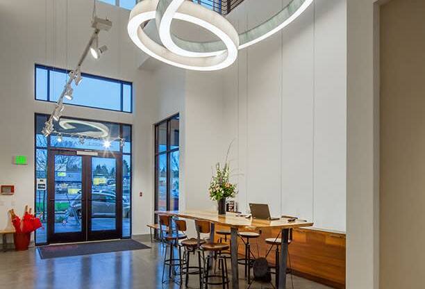 a dining room with a table and chairs and a chandelier