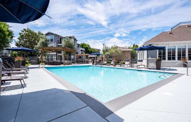 Outdoor pool area with lounge chairs