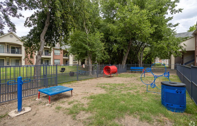 a video game of a park with a playground and trees