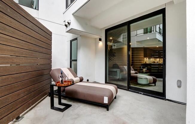 a bedroom with a bed next to a sliding glass door