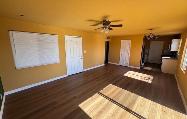 Colorful bungalow style home with plenty of yard.