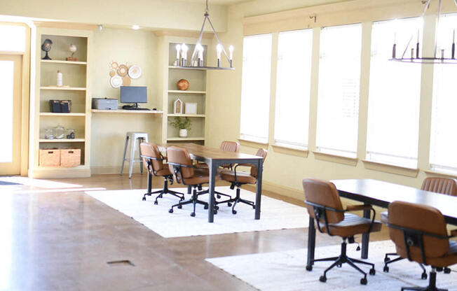 a dining room with a table and chairs