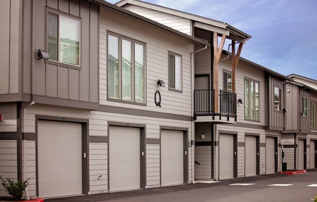 a row of garages in front of a building