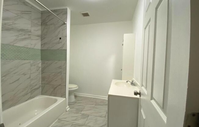 Updated 2-Bedroom Home with Finished Basement and Private Yard Near University City