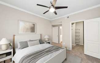 Model Bedroom with Carpet and Walk In Closet at Allure North Dallas Apartments located in Dallas, TX.