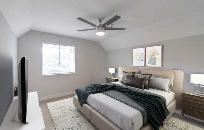 a bedroom with a bed and a ceiling fan