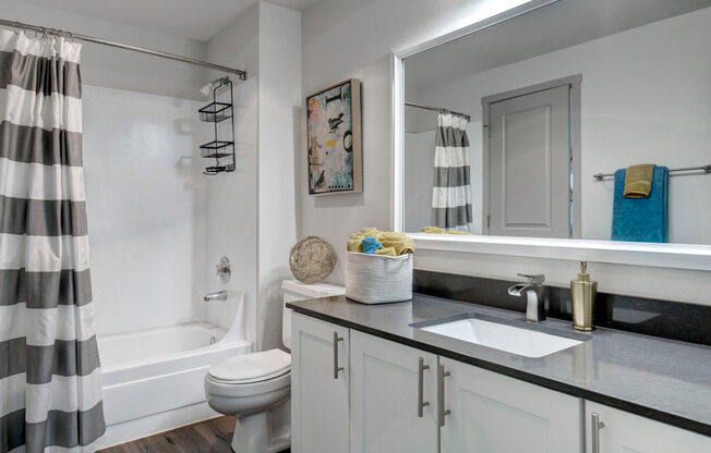 a bathroom with a sink toilet and bathtub