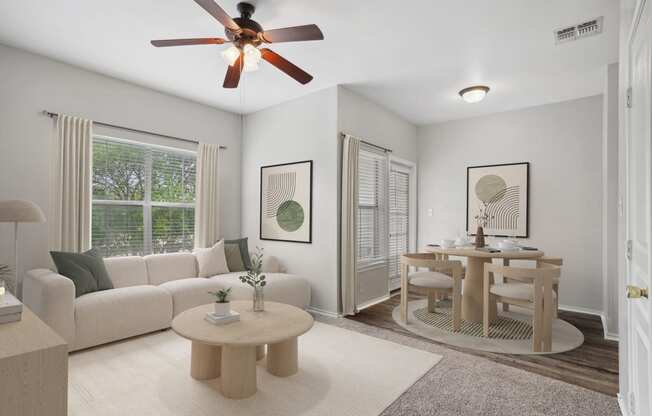 a living room and dining room with a couch and a table