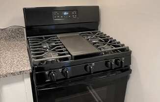 Black stovetop at Barracks West apartments in Charlottesville, VA