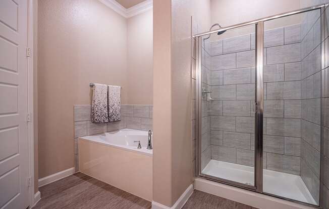 Bathroom facing soaking tub and stand up shower