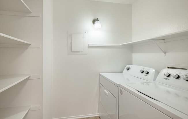 a laundry room with a washer and dryer