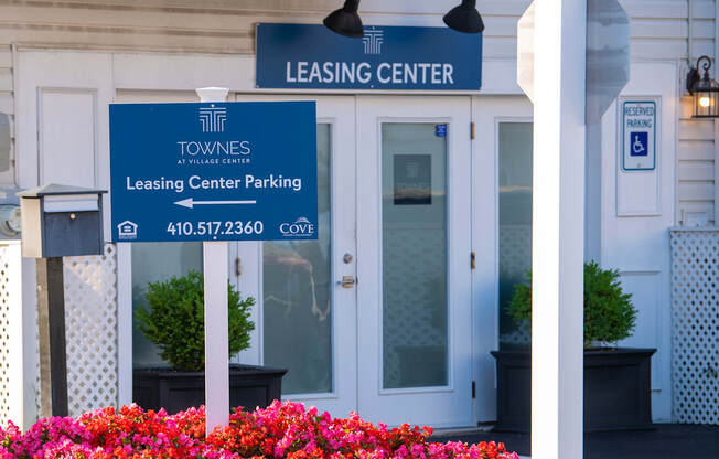 the entrance to the leasing center of the towers leasing center parking building