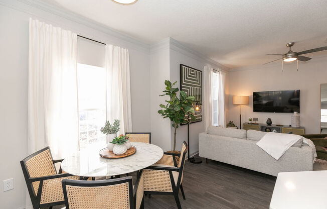 a living room and dining room with a couch and a table at Deerfield Village, Georgia