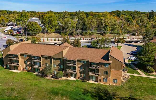 A large apartment complex with multiple buildings and green lawns.