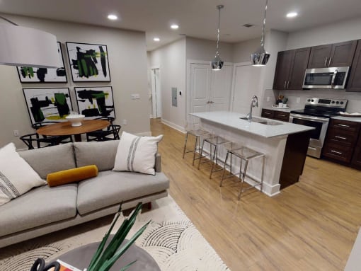 a living room with a kitchen and a couch