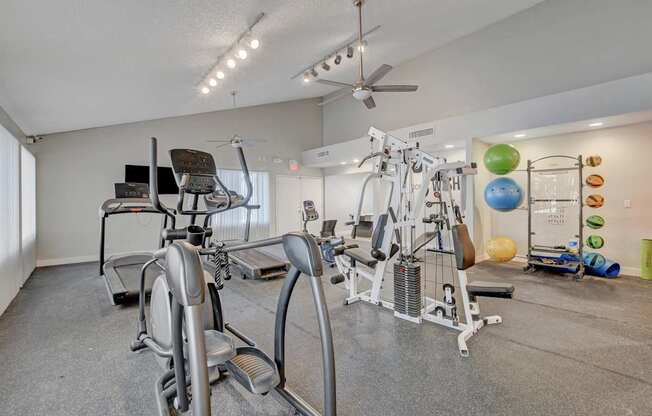 A home gym with a variety of exercise equipment.