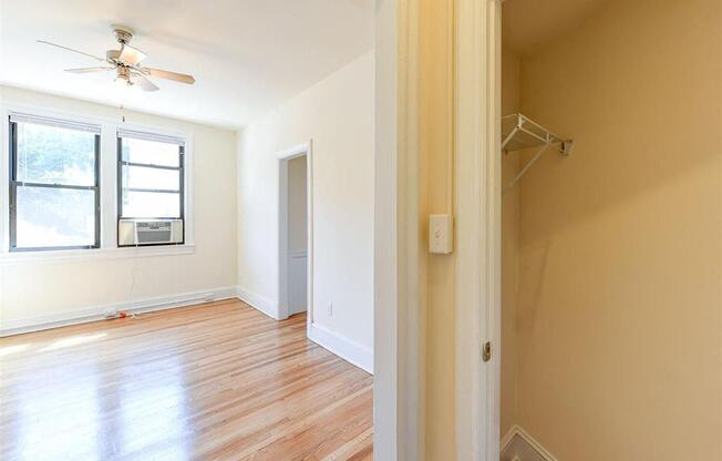 large closet with view of living area at the klingle apartments in washignton dc