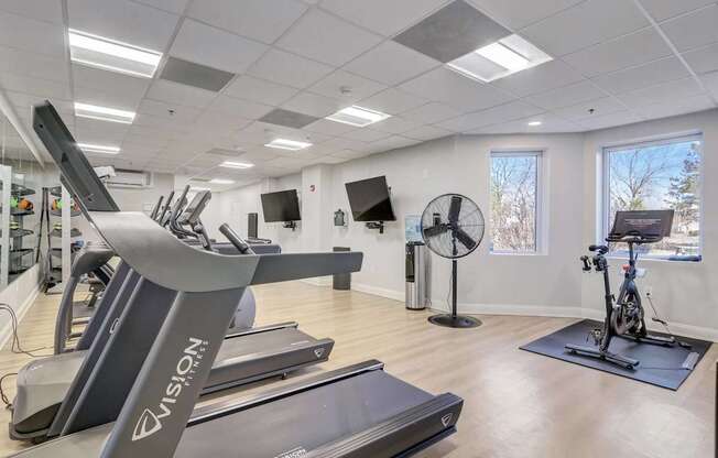 24/7 Fitness Center with Cardio Equipment, Free Weights, and Strength Training.