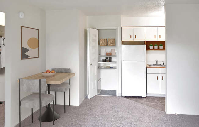 A kitchen with a closet/pantry and dining area at Brookside Apartments, Springfield