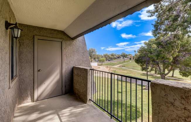 the view from the balcony of a building with a door to a balcony with a