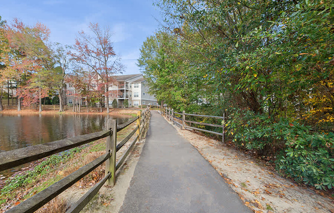 Community Walking Path and Lake at Lake Cameron Apartments located in Apex, NC.