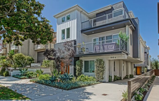 Custom, Modern & Spacious Tri-Level Home w/ Amazing Great Room Living Space, 4 Balconies/Decks, Ocean Views & 2-Car Garage Close to Schools, Restaurants, Shopping & Just 4 Blocks to Beach!