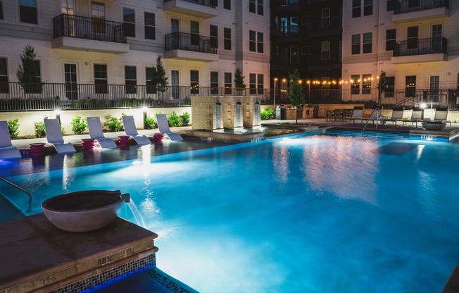 Night view of resort-style pool