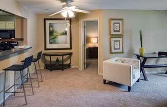 a living room with a couch and a dining room table