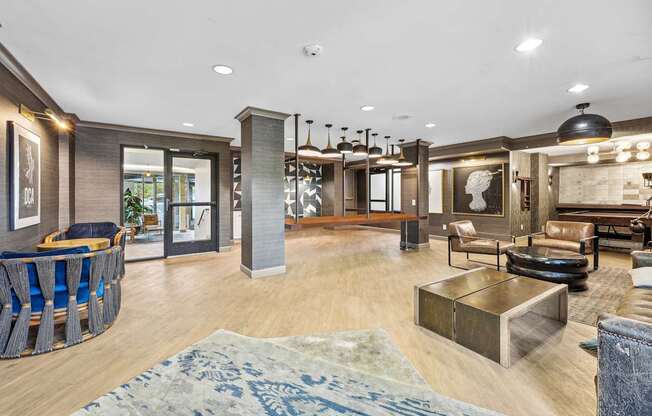 A living room with a blue rug on the floor.