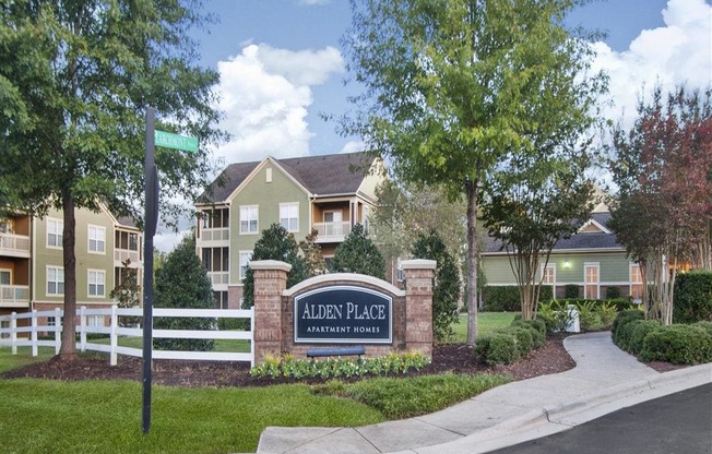 Lush landscaping surrounds you as you drive at Alden Place at South Square Apartments, Durham, NC 27707