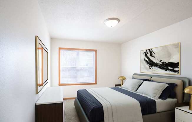 A bedroom with a bed, nightstand, and a painting on the wall. West Fargo, ND Sheyenne Terrace Townhomes
