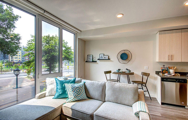 a living room with a couch in front of a window