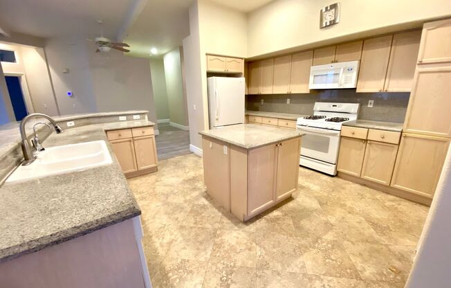 Single story home in guard gated Rhodes Ranch Community with an open kitchen in a great room, a large backyard with a covered patio, and all hard flooring throughout(tile & LVP). Community amenities available to tenants such as the club house, gym, basket