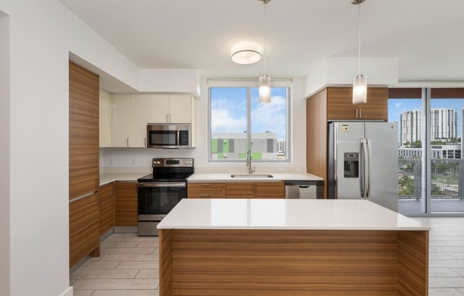 a kitchen with white countertops and wooden cabinets