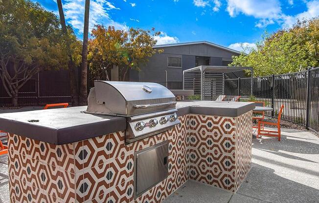 a barbecue grill sitting on top of a sidewalk