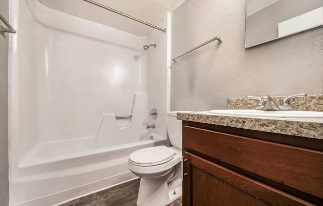 a bathroom with a toilet sink and bathtub