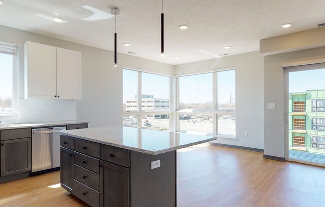 Open concept kitchen and living-dining space in the Shine floor plan at Haven at Uptown in Lincoln, NE