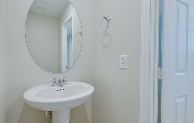 Mountains Edge!! Gated!!  4 bedrooms!! Primary Bedroom and bath down Stairs!! 2 Primary bedrooms!! Built 2021!!