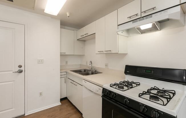 Kitchen with White Cabinets and Hardwood Floors