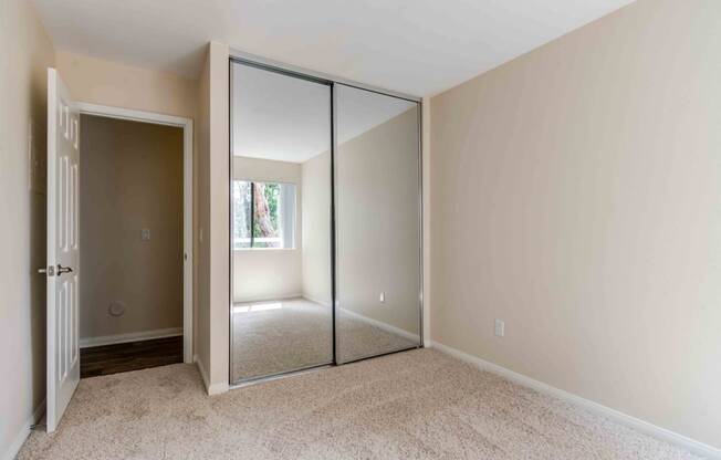 large walk-in closets with mirrored doors